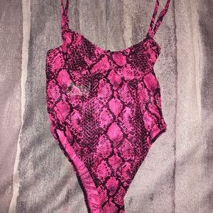 Never worn before bodysuit with tags